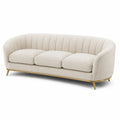 Canapé trois places en tissu bouclé beige avec pieds en métal doré