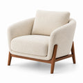 Fauteuil en tissu bouclé beige avec cadre en bois